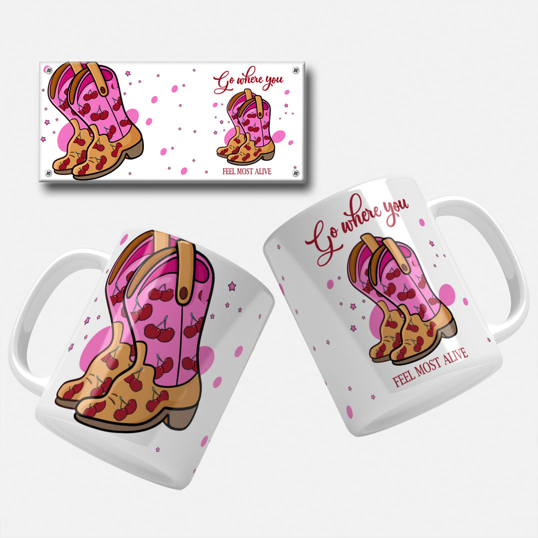 "Go Where You Feel Most Alive" mug wrap design featuring pink cowboy boots with red cherries, set against a background of pink stars and dots, with an inspirational quote in red text.