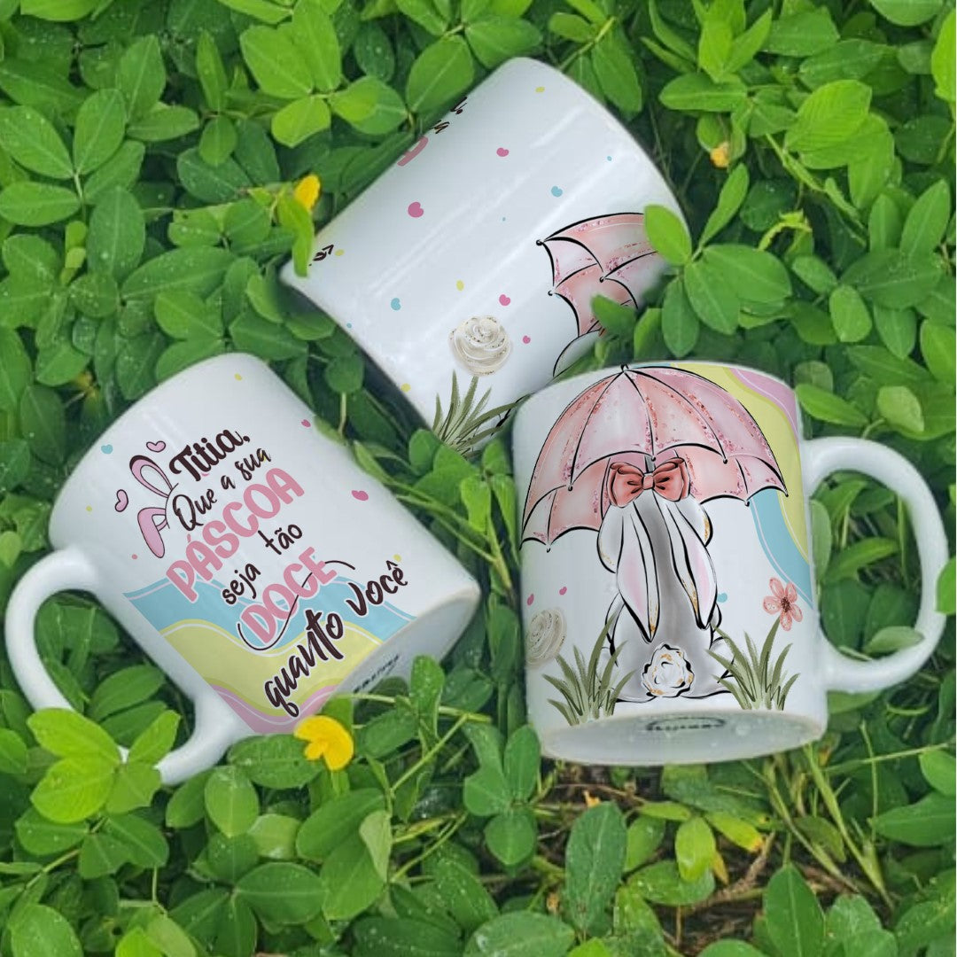Three mugs with colorful designs on a grass background