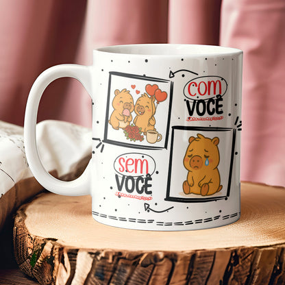 White mug with cartoon bear designs and text on a wooden surface.