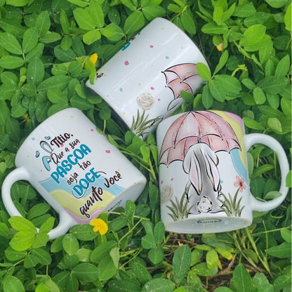 Three Easter-themed mugs on a grassy background