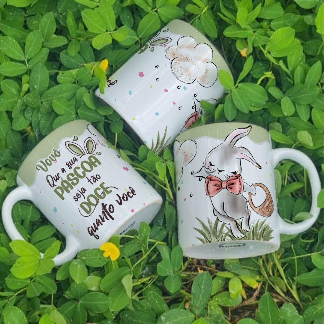 Three mugs with decorative designs on a grass background