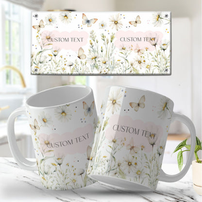 Two white mugs with floral designs and 'Custom Text' text on a light background.
